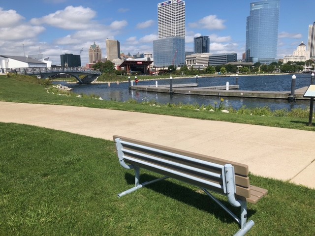 A bench in Lakeshore State Park overlooking the city of Milwaukee